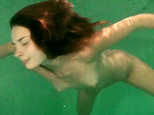 Saucy Honey Dives Into The Pool And Fingers Her Orgasmic Twat